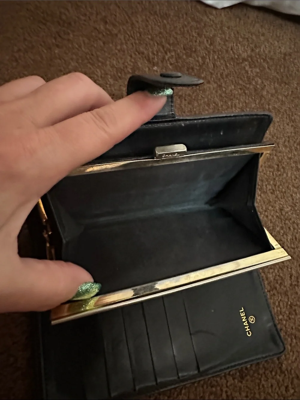 CHANEL Black Quilted CC Caviar Leather wallet.